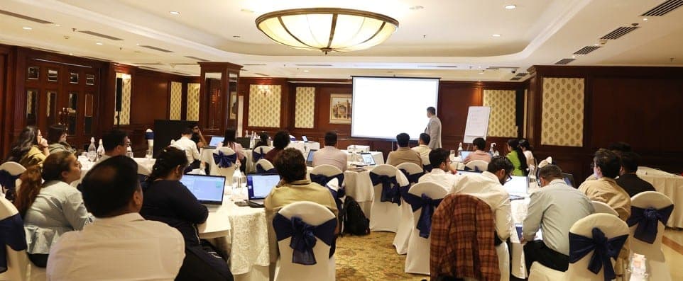 Business owners working hands-on with AI tools at a Sheraton workshop